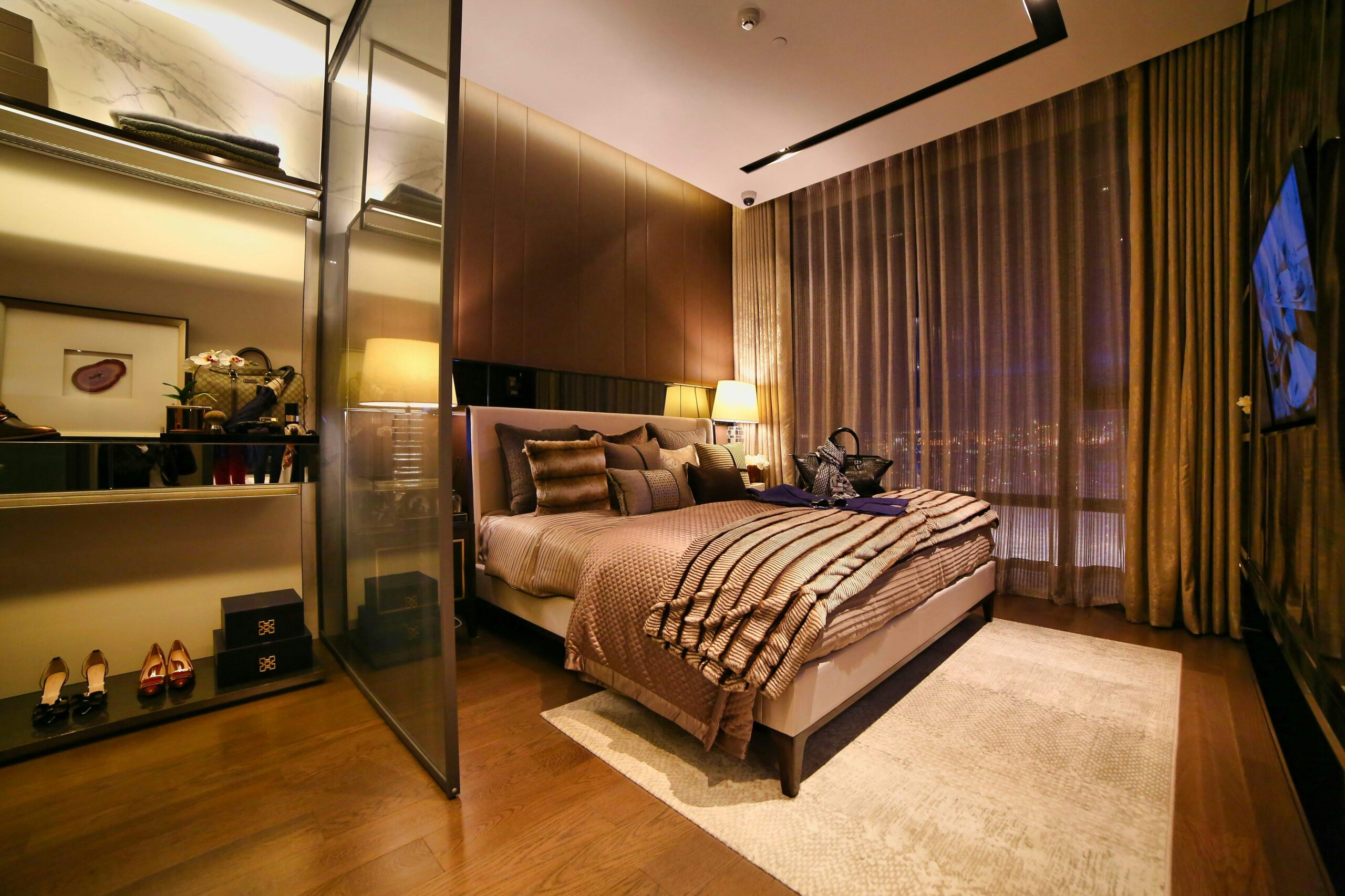 Cozy luxurious bedroom with modern design, warm lighting, and elegant decor.